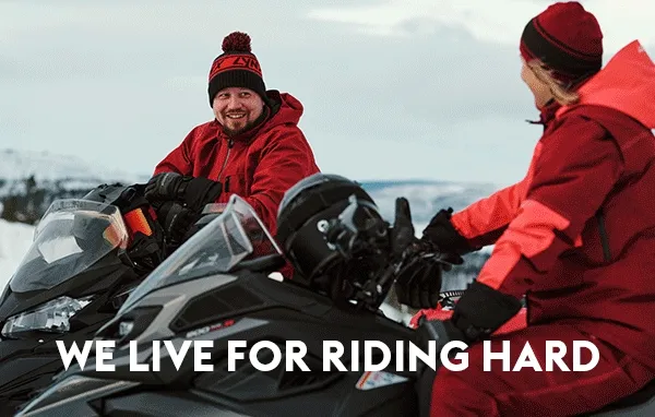 Two Lynx riders on sleds