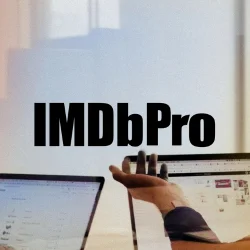 IMDb Pro logo on a light blue office background with people working at their computers.
