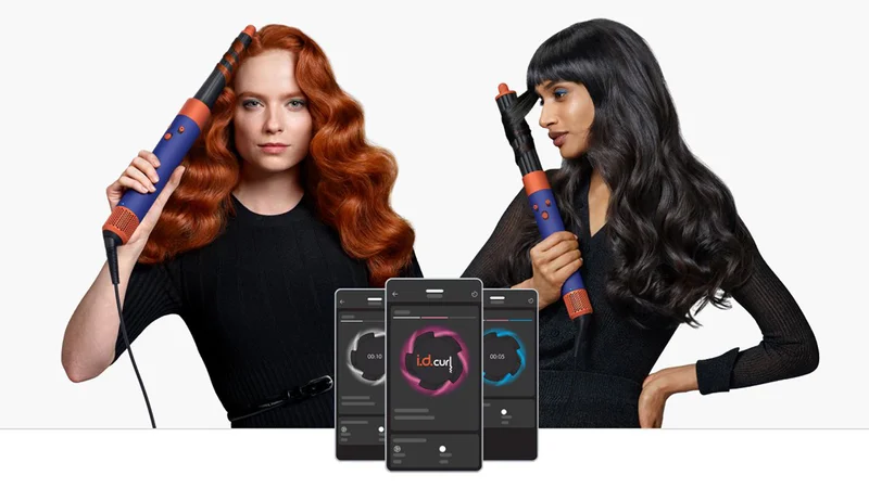 Models using the Dyson Airwrap i.d. to style their own hair and three mobile phones in front of them