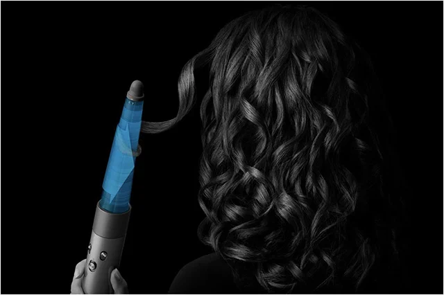 Model curling hair with the conical barrel attachment