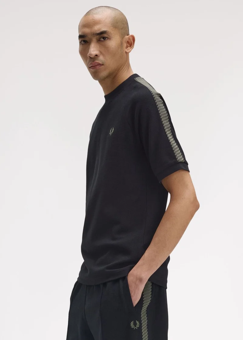 Male model wearing a Fred Perry Tennis Grip Taped T-Shirt