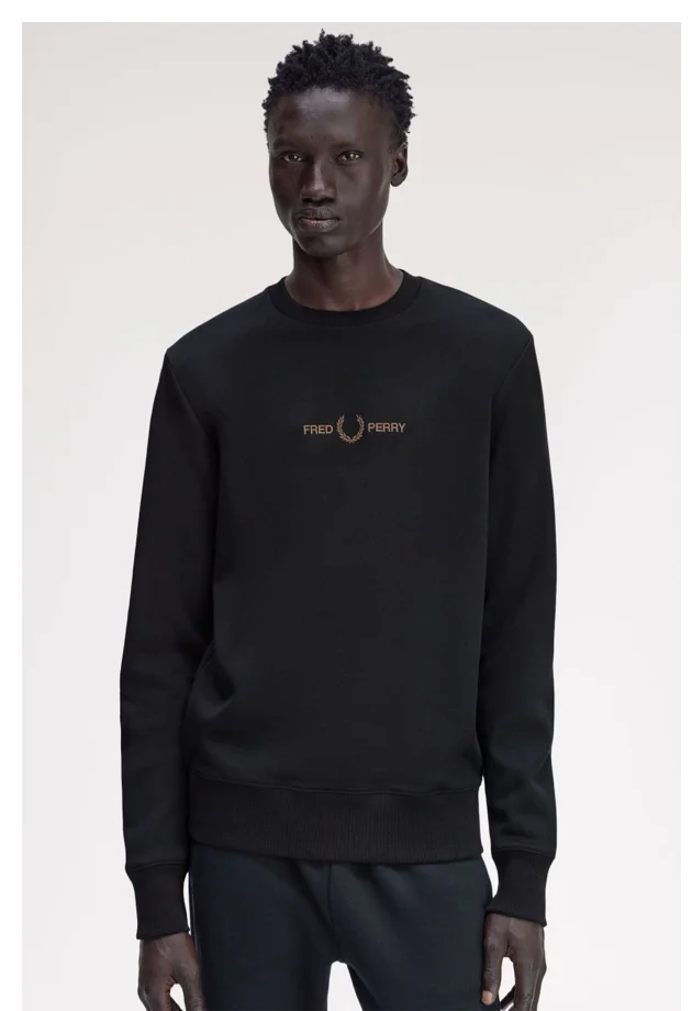 Male model wearing a Fred Perry Embroidered Sweatshirt in Black / Shaded Stone