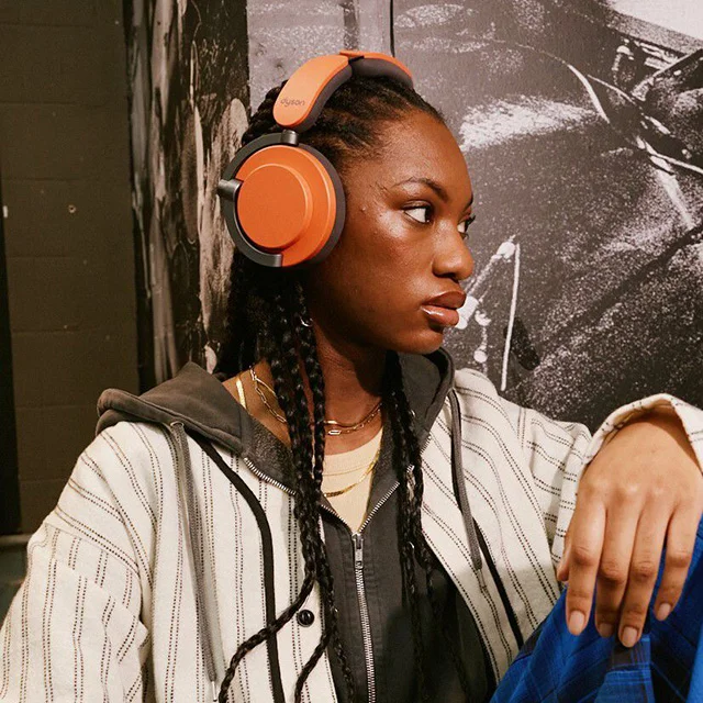 A model wearing Dyson OnTrac headphones