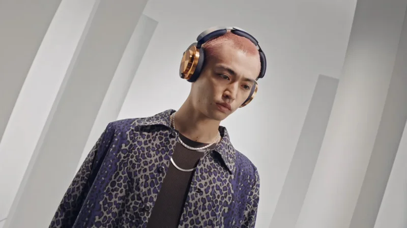 A model wearing Dyson OnTrac headphones