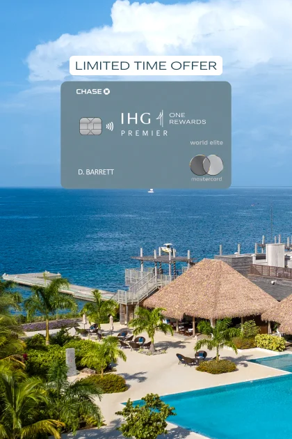 The IHG One Rewards Premier Credit Card atop a tropical hotel landscape.