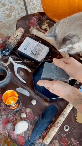 Two white hands washing with the black soap