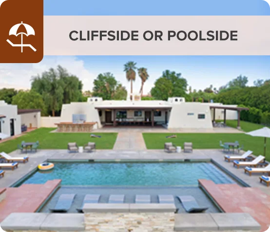 Modern villa with a large pool and lounge chairs in a lush green setting.
