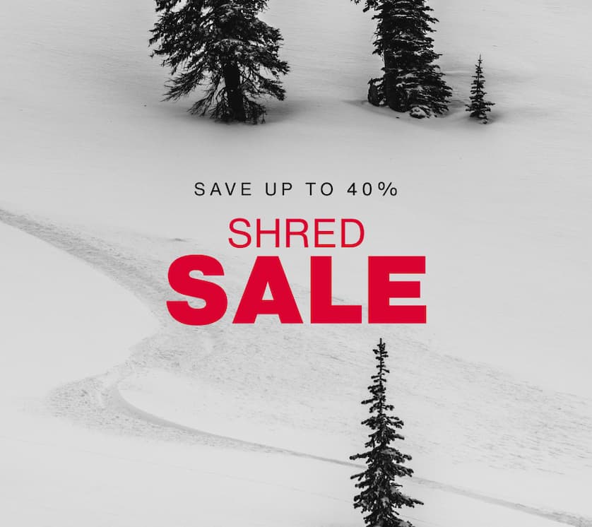 Darkened image of a rider's line in the backcountry. The text SHRED SALE repated in white on a red background a the bottom. Underneath, the text 'Sale runs 3/4-3/11. Save up to 40%'.'