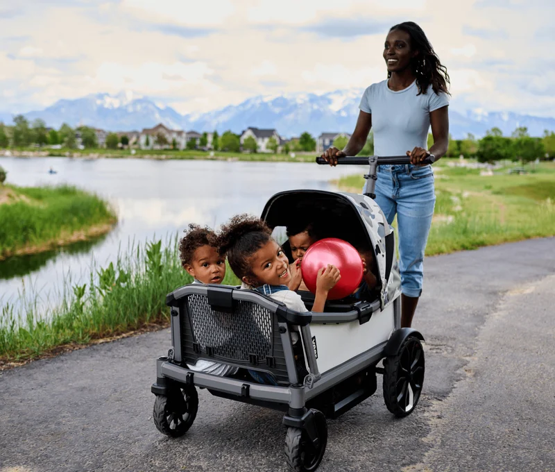 A mom walking her children in Veer Cruiser City by the lake