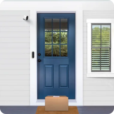 Front door of home with various Arlo home security products mounted on the exterior.