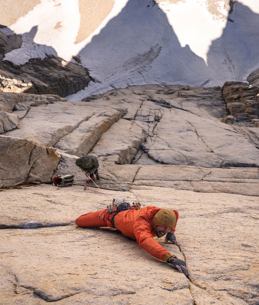 Looking down on  two climbers high on a big wall.