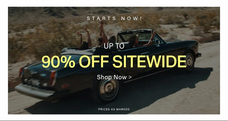 Dark convertible with happy people driving through a desert, promoting a huge sitewide sale with up to 90% off, starts now!