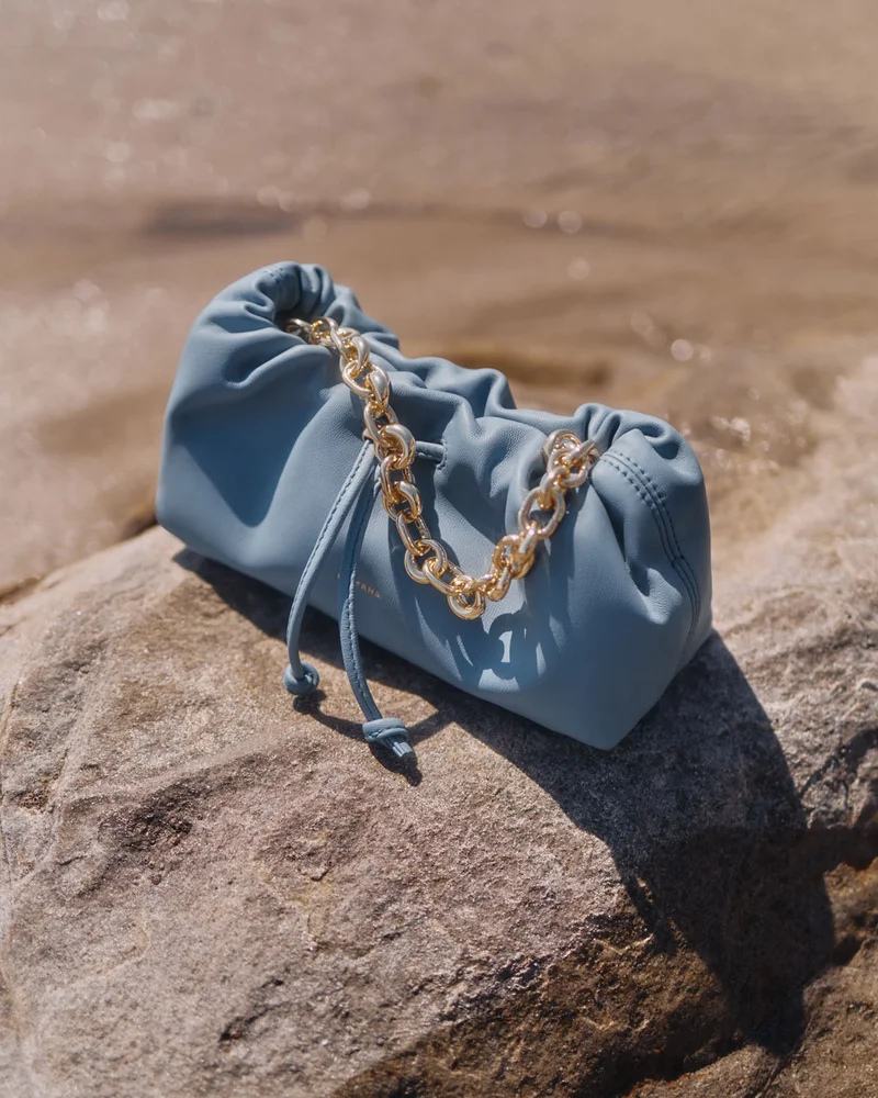 Nano Dia Bag Azure Blue with attached chain strap