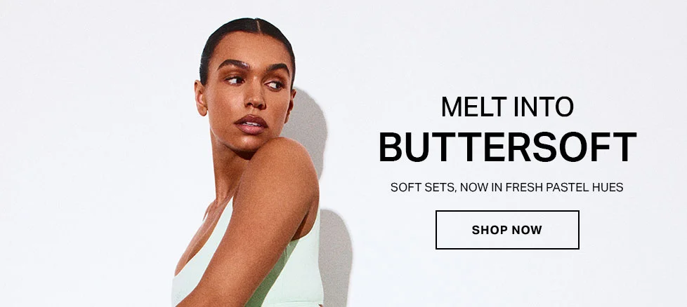 BUTTERSOFT soft sets in fresh pastel hues. Woman wears light green activewear. Shop now!