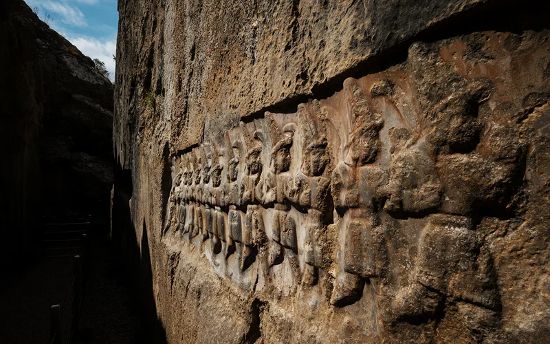 A procession of gods marches across the wall of what may have been a royal mausoleum near Hattusa, capital of the lost Hittite Empire.