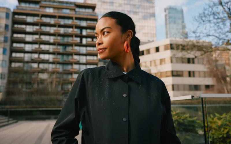 Lifestyle graphic of a model wearing the Westerly Coach Jacket in Black.