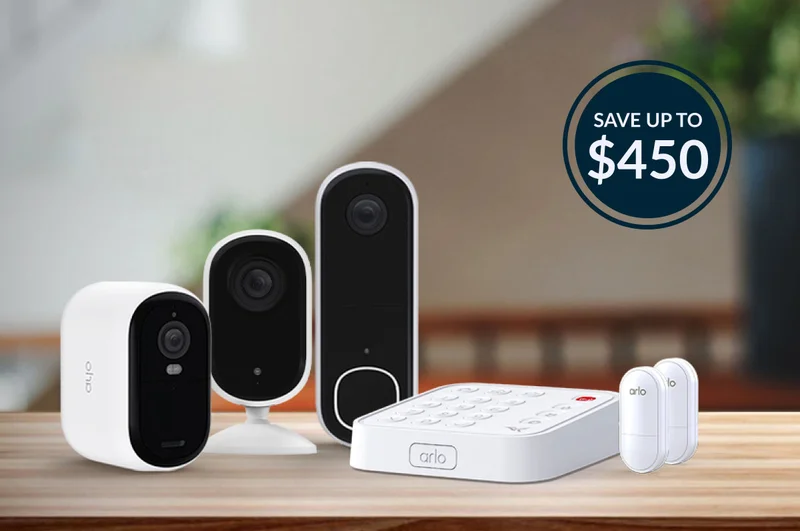 Arlo Essential 2K Wireless Security Camera, Essential 2K Indoor Camera, and a Video Doorbell 2K next to a Home Security System.