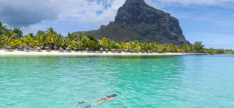 A tourist swimming in Le Morne, Mauritius