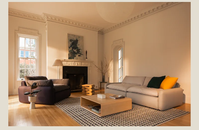 Pictured: The Sink Down Sectional and Lounge Chair, Peak Rug, & Modular Table.