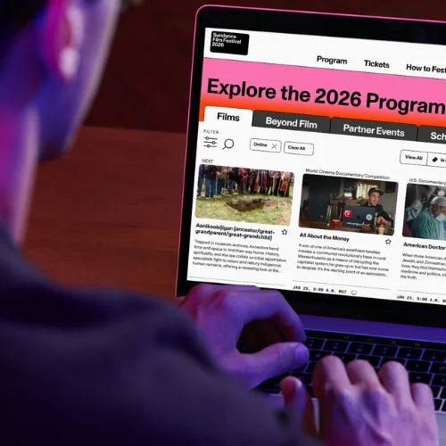 Image of an individual browsing the 2026 Sundance Film Festival website on a computer.