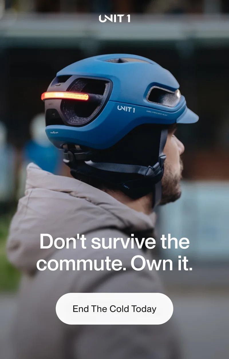 Close-up lifestyle image of rider wearing UNIT 1 helmet during winter commute.