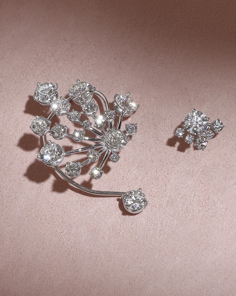 Custom lab-grown diamond earring cuff, a 2.8-carat diamond stud and a matching brooch Custom lab-grown diamond earring cuff, a 2.8-carat diamond stud and a matching brooch