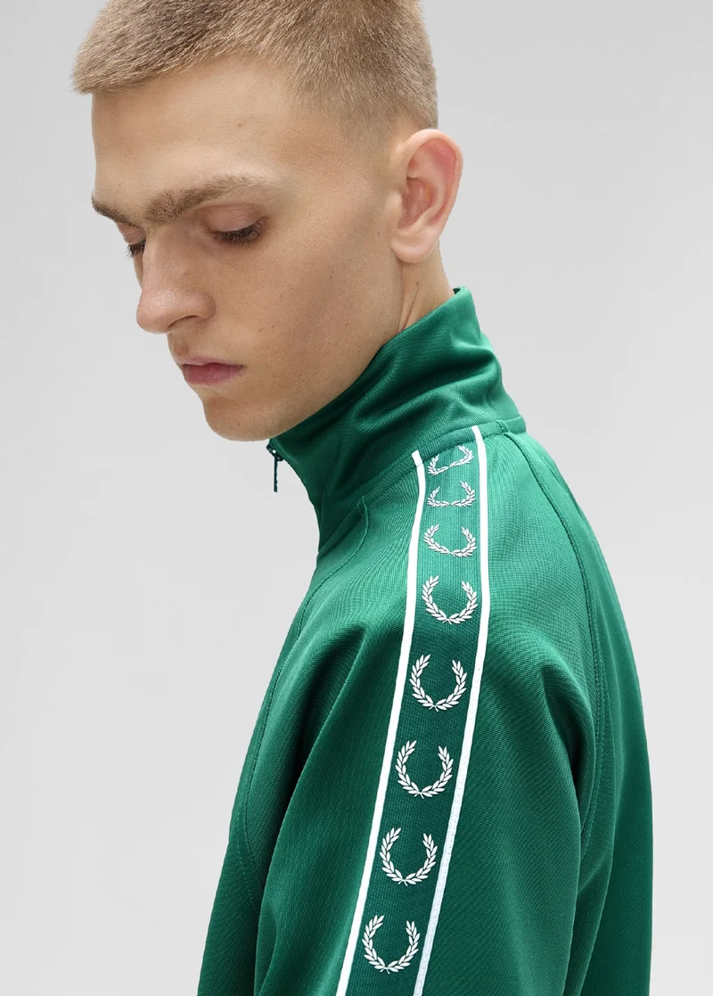 Close up of a Fred Perry Tape Contrast Track Jacket in Sport Green