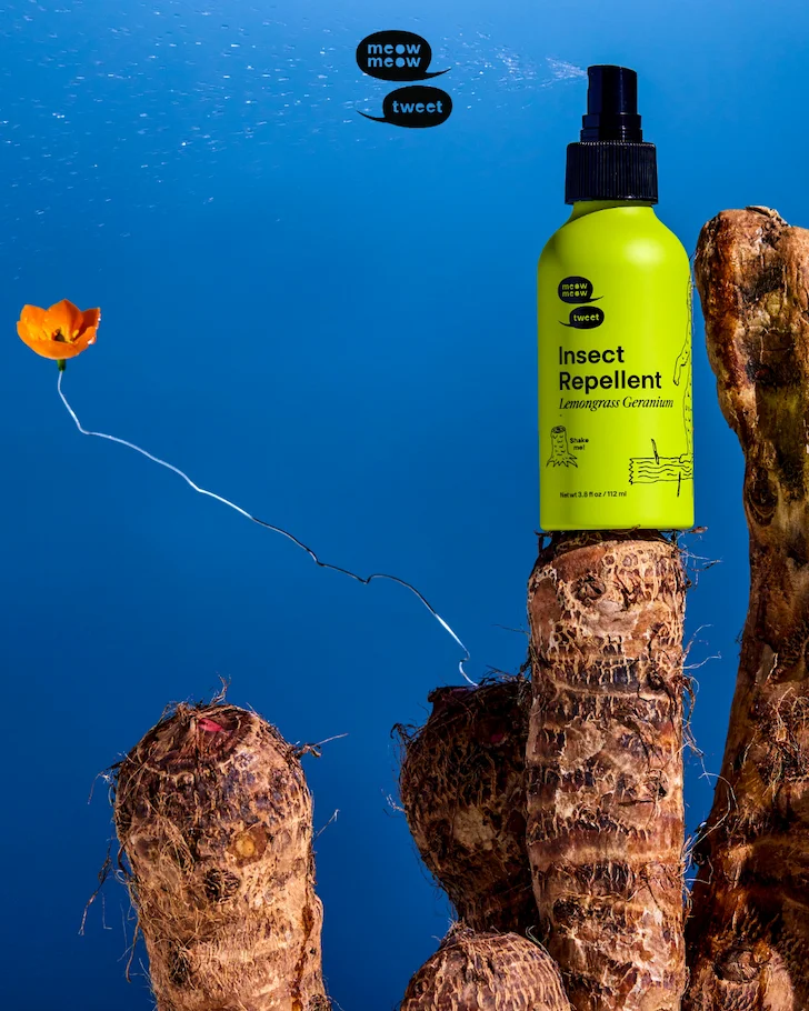 A green bottle of repellents spritzes to the left and sits atop woody yucca pedestals