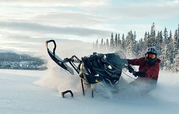Images of riders on Lynx snowmobiles
