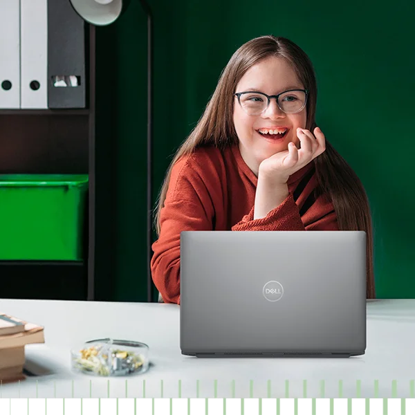 girl in red sweater with laptop laughing