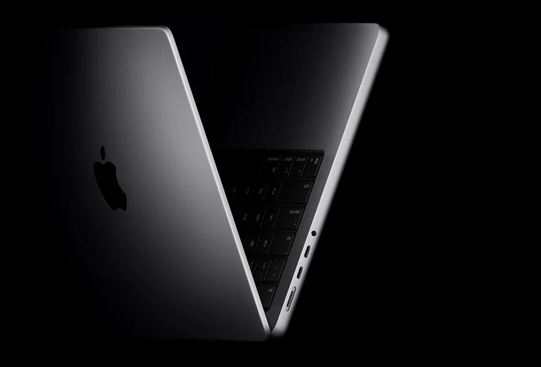 MacBook Pro positioned into the shape of a V, referencing the M5 chip