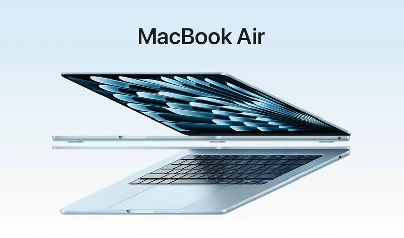 Two open MacBook Air laptops in sky blue color forming arrow shape, emphasizing narrow profile