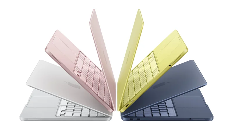 MacBook Neo laptops in silver, blush, citrus, and indigo colors, slightly open and arranged in an arch formation