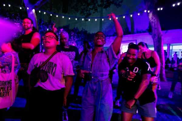 A photograph of audience members dancing