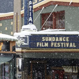Two women laughing during a panel at the Festival.