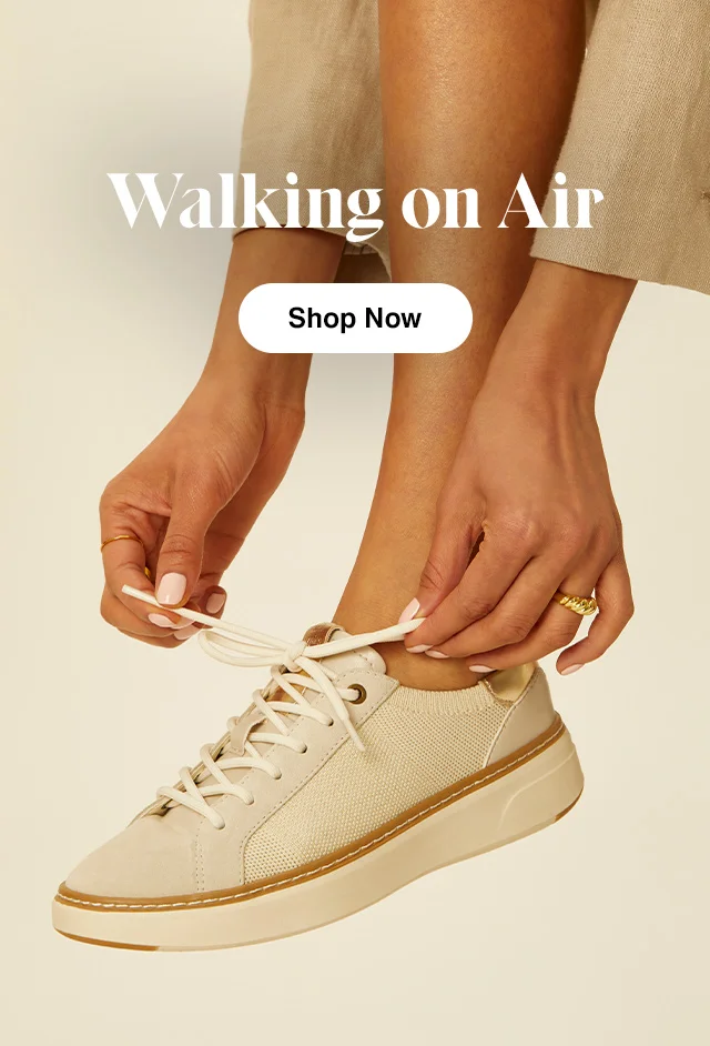 Woman tying the Off-White Cane Sneaker. Shop the Cane Sneaker.