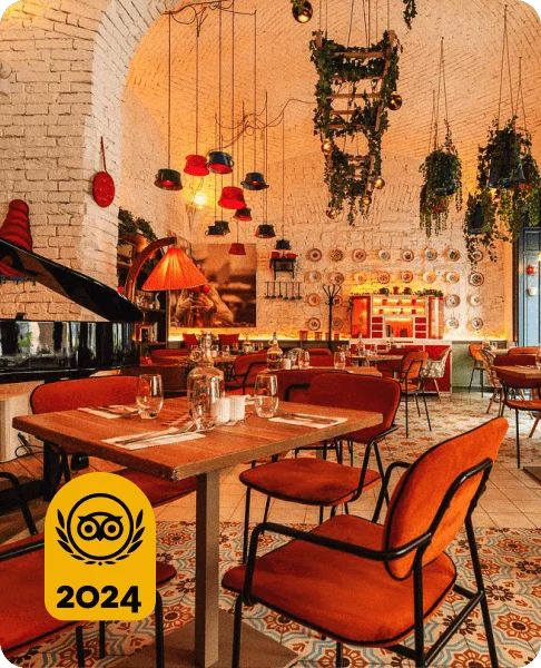 Image Description: The warm and spacious interior of Retek Bisztro, a Hungarian restaurant in Budapest