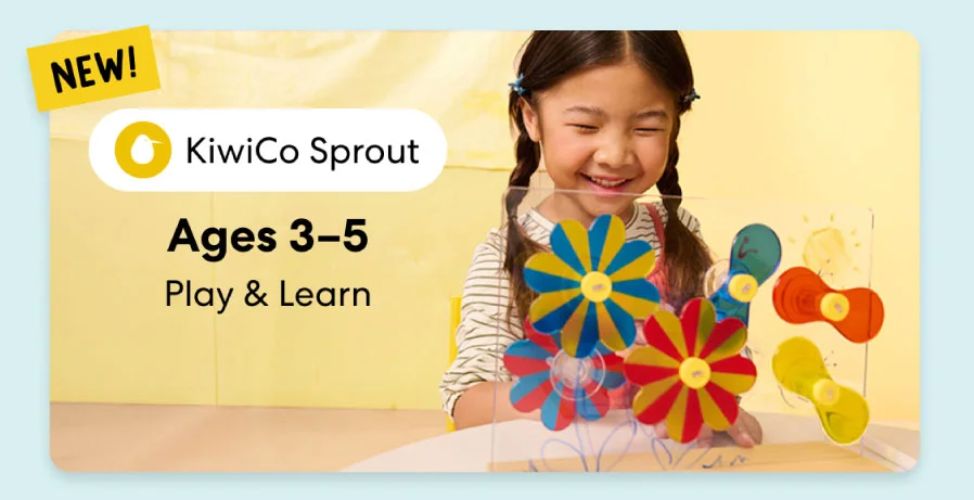 Young child smiling while working on creative KiwiCo Sprout projects, perfect for ages 3–5 for play and learn.