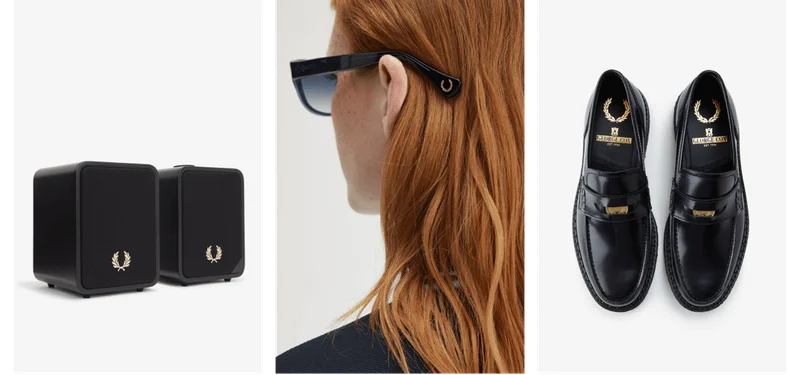 A female model wearing a twin tipped long sleeved Fred Perry Shirt in Black / Flamingo Tan / Flamingo Tan