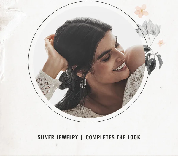 silver jewelry, completes the look