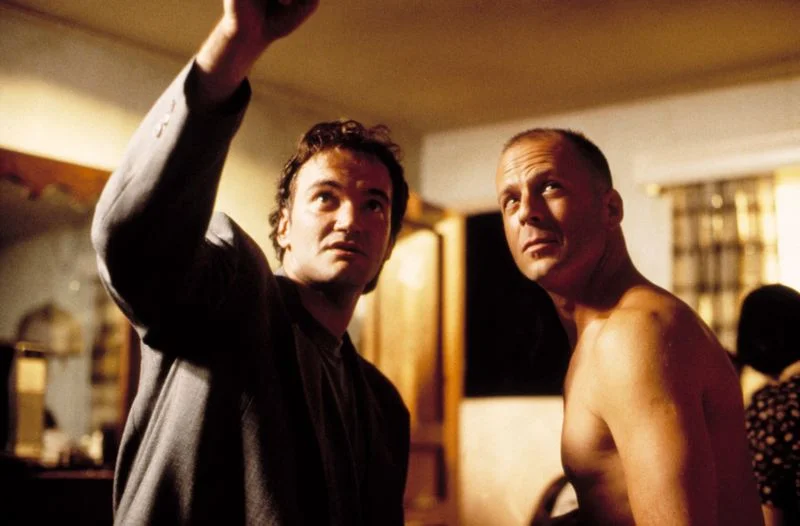 Bruce Willis with Quentin Tarantino on the set of 'Pulp Fiction,' one of the best Bruce Willis movies