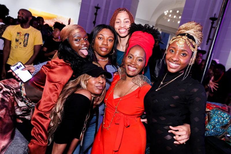 A group of people smiling and posing