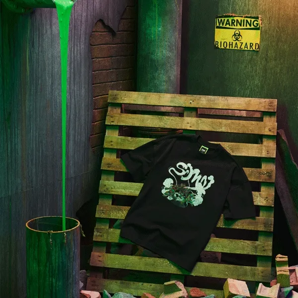 Images of the SDMN x TMNT T-shirts in a sewer environment