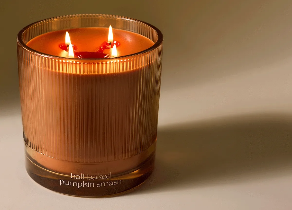 fluted glass vessel — soy and vegetable wax blend — fine fragrance-level scent — 200+ hours of burn time — four 100% pure cotton fiber wicks