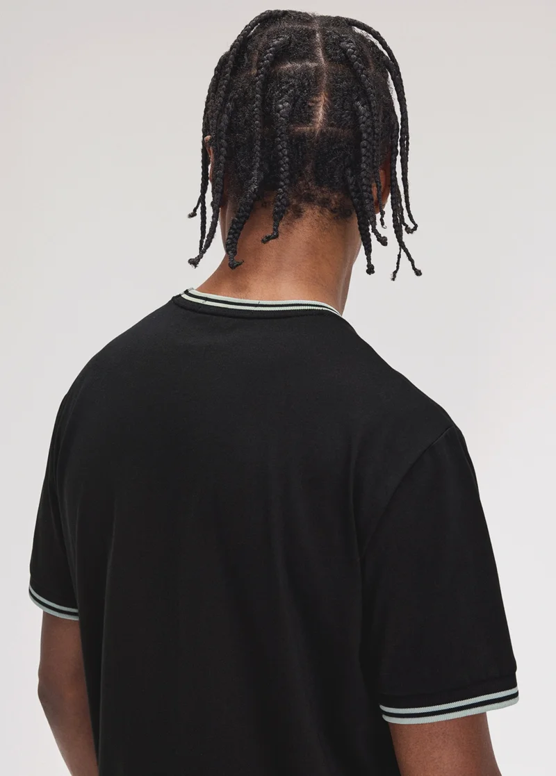 Male model wearing a Black and Silverblue Twin Tipped Fred Perry T-Shirt