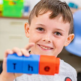 A child holding blocks