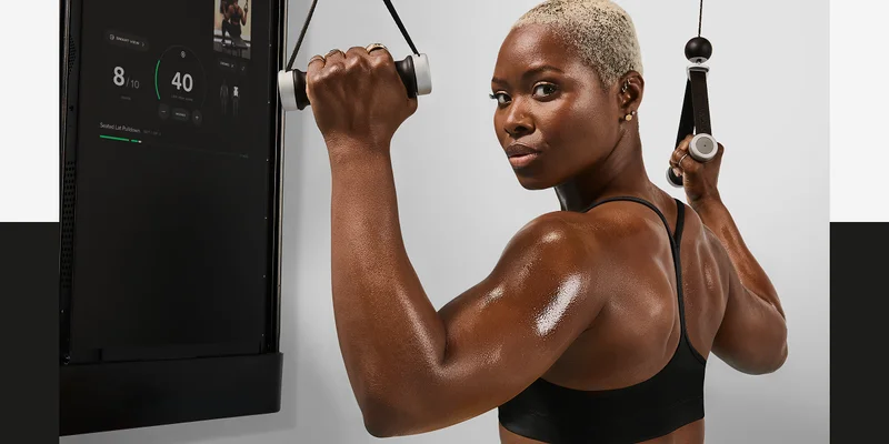 A girl working out with Tonal