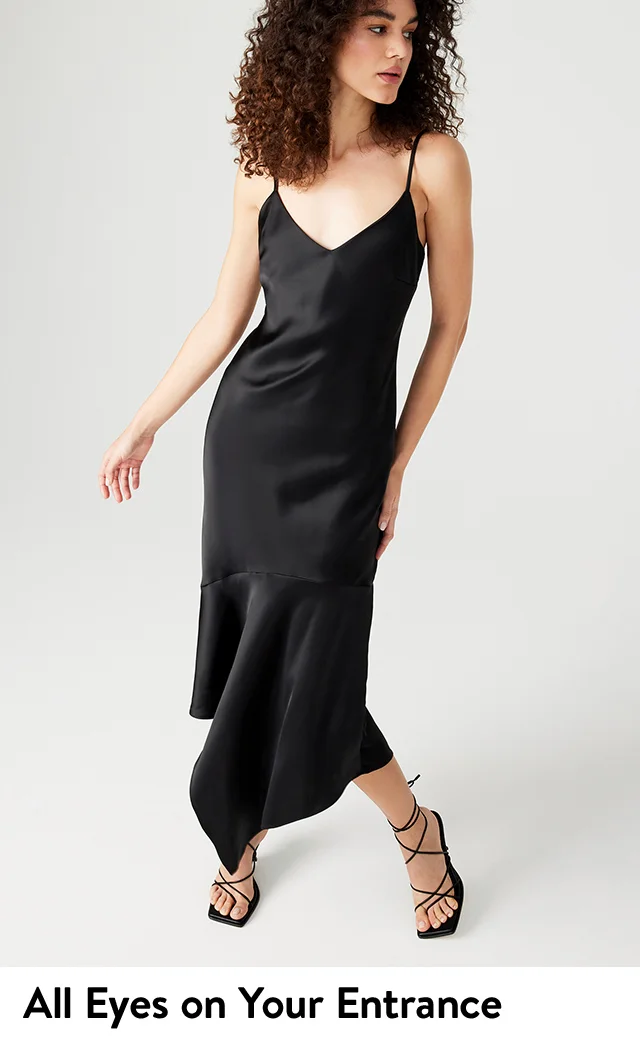 A woman wearing a black slipdress.