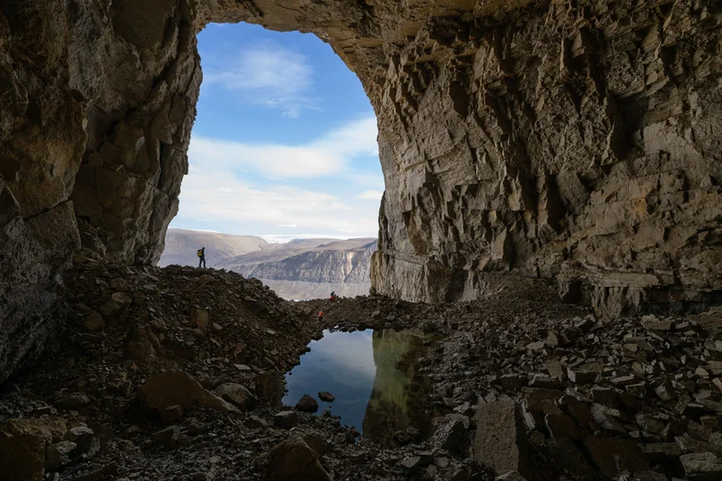 Paleoclimatologist Gina Moseley led a team of scientists to Greenland’s northernmost caves, including the Wulff Land Cave (shown here). They were searching for geological time capsules—mineral specimens called speleothems that hold the climate history of a distant, warmer past.