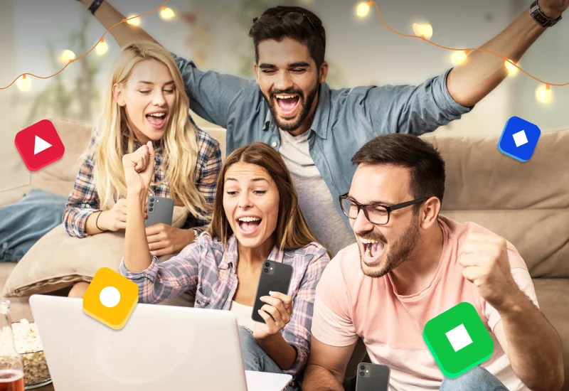 group of men and women celebrating playing kahoot